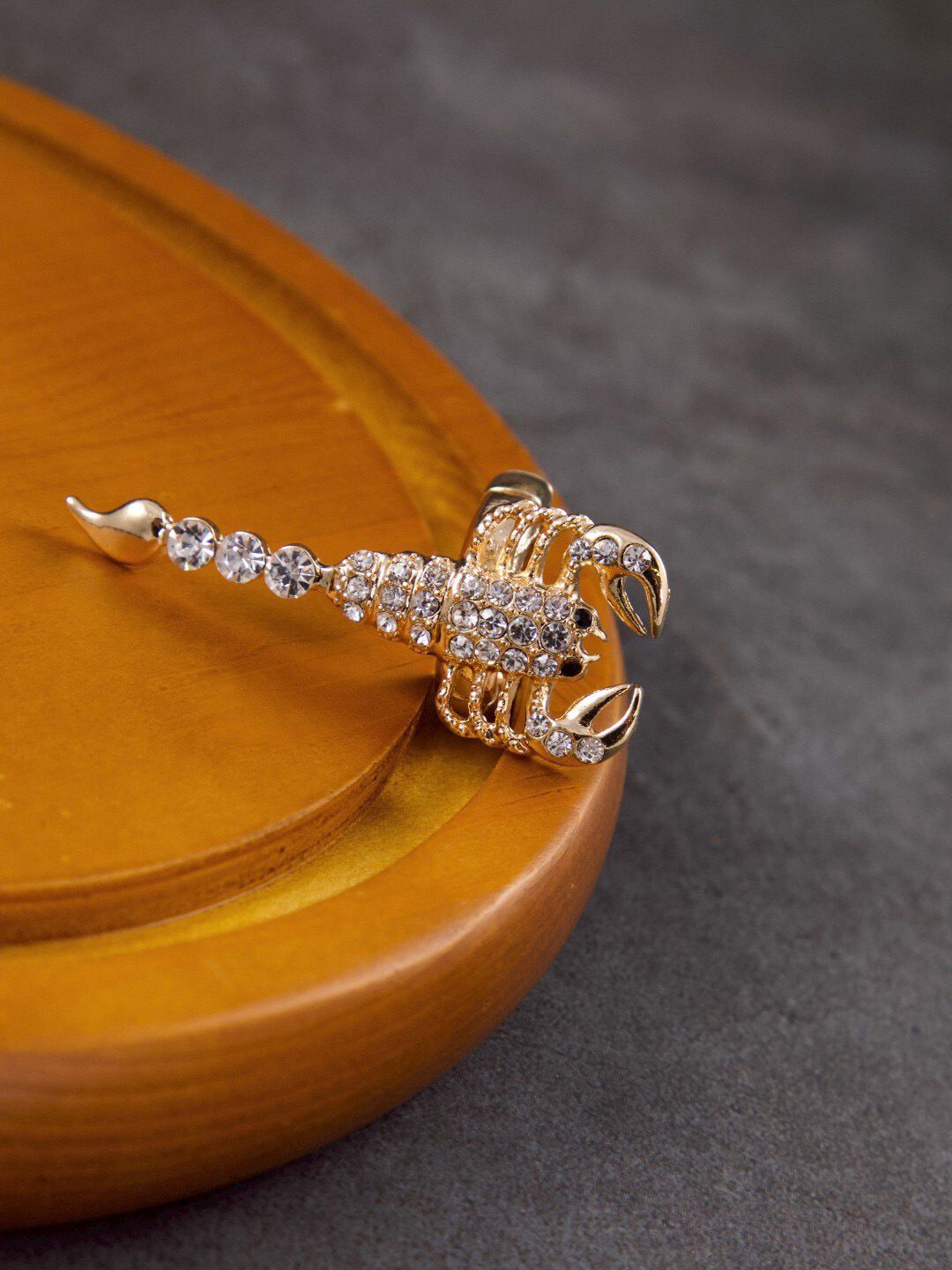 anore Gold-Plated & White Stone Studded Scorpion Statement Finger Ring Price in India