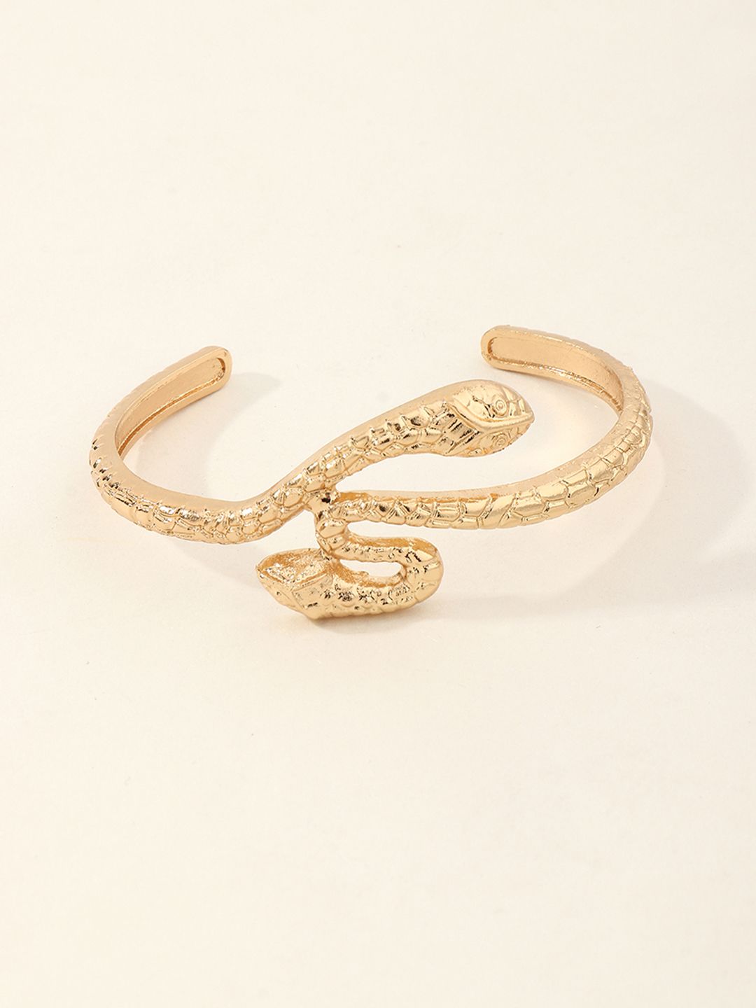 URBANIC Women Gold-Toned Animal Design Cuff Bracelet Price in India