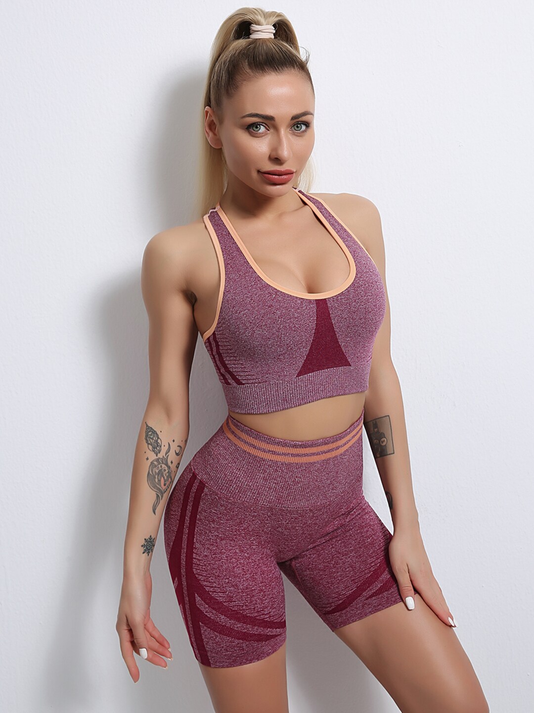 URBANIC Women Maroon Solid Styled Back Gym Tracksuit Price in India