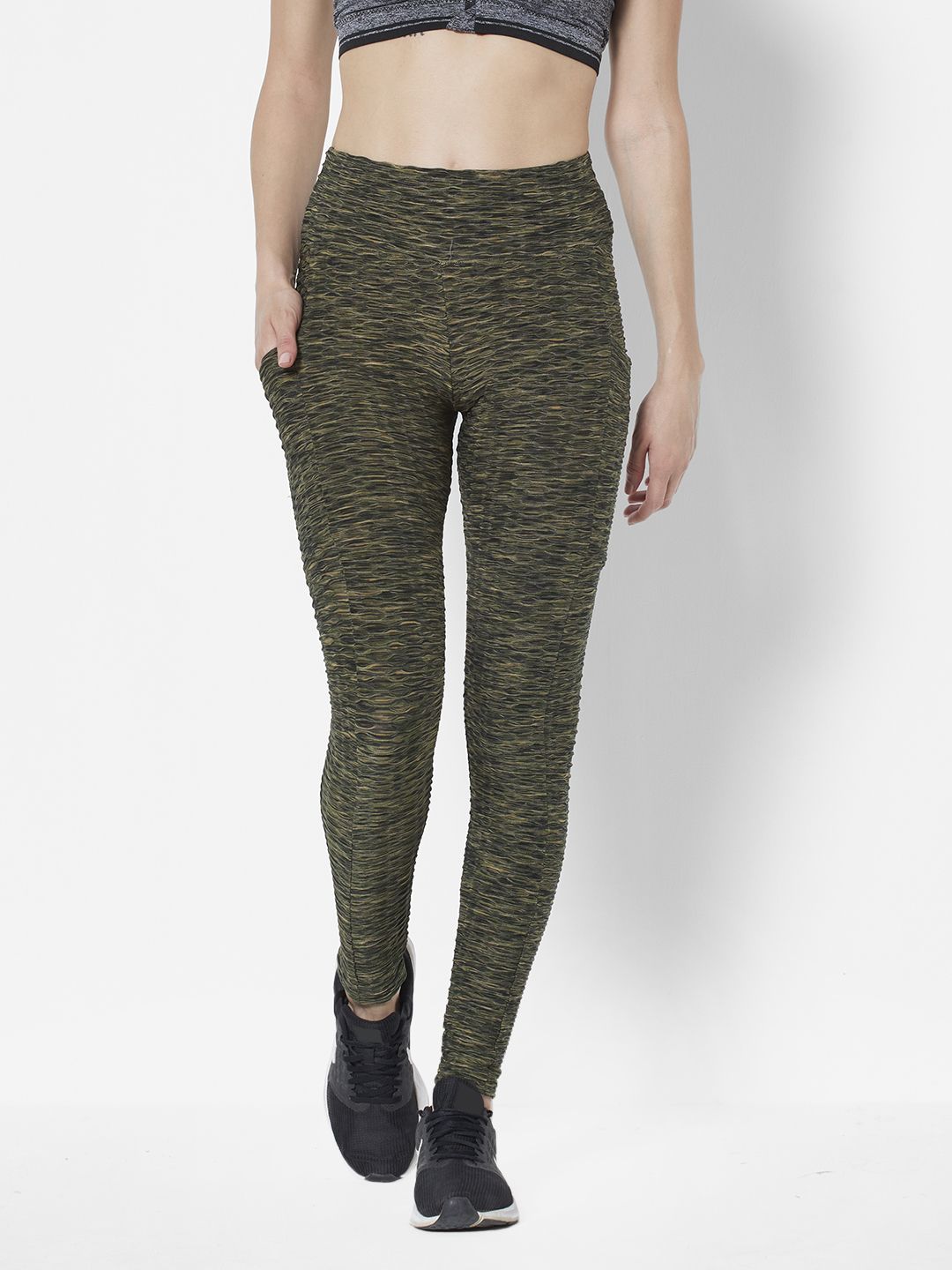 URBANIC Women Olive Green & Black Abstract Print Slim Fit Ruched Gym Tights Price in India