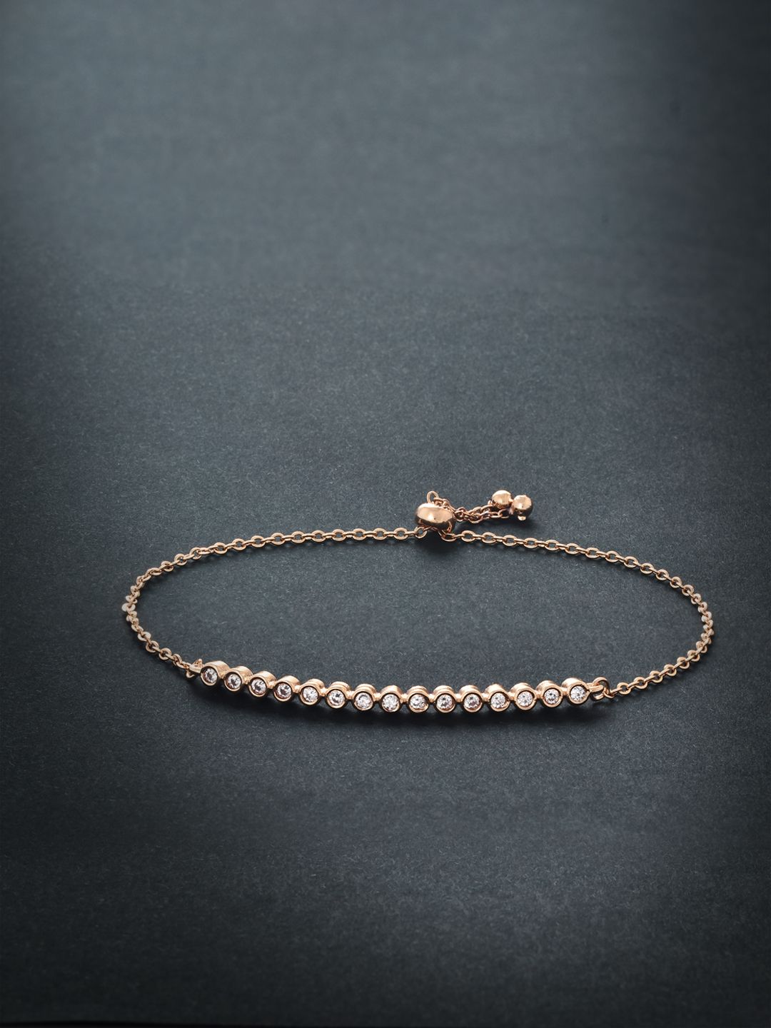 MINUTIAE Women Rose Gold & White Brass Crystals Handcrafted Rose Gold-Plated Link Bracelet Price in India