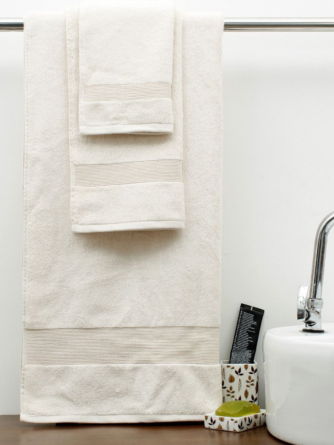 AVI Living Set Of 4 Cream Self Design Cotton Towel Set Price in India