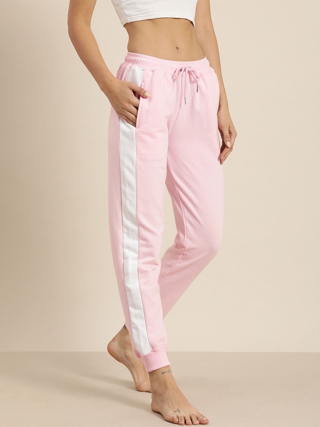 Pink joggers store with white stripe