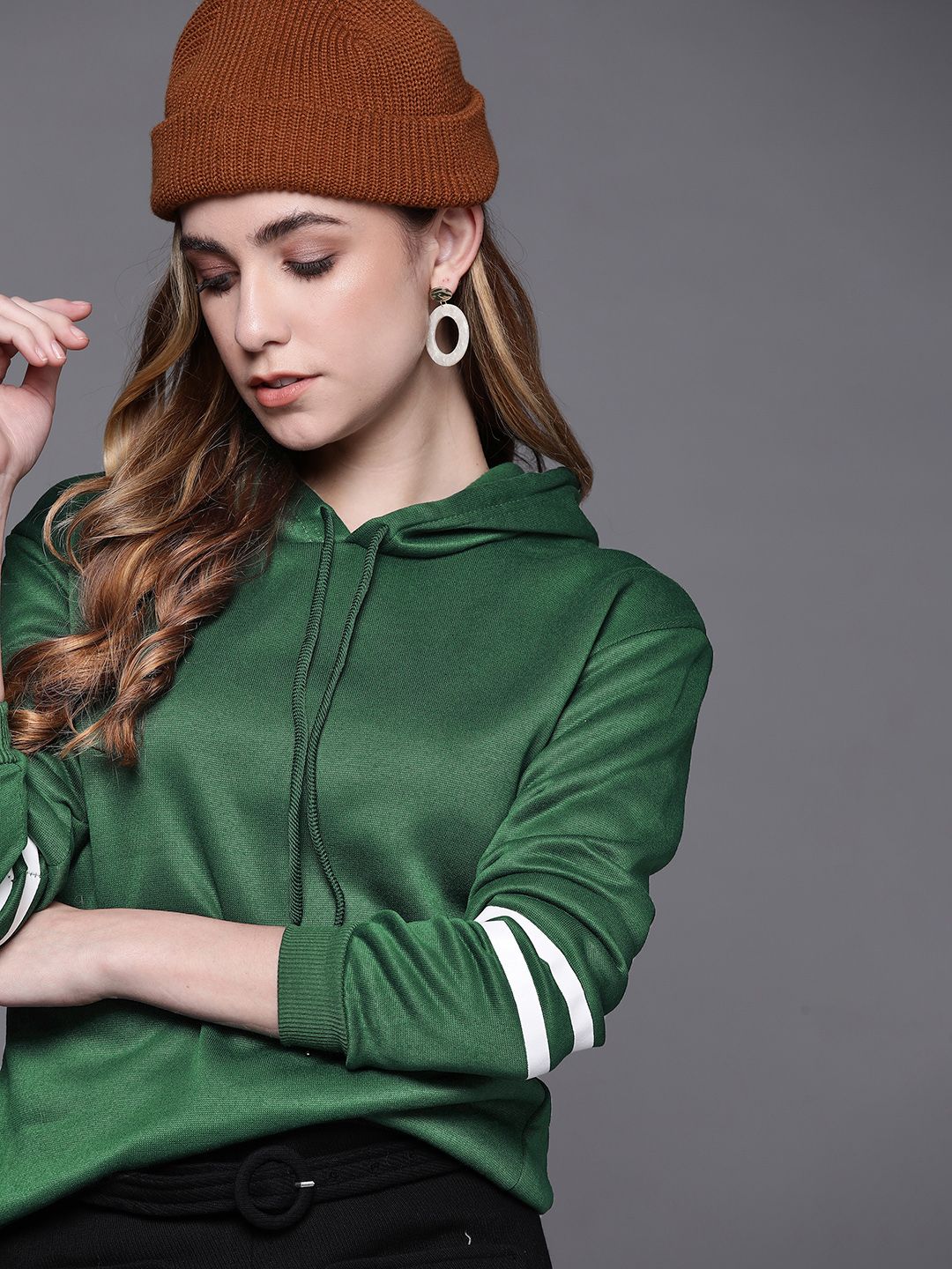 JC Mode Women Green Solid Hooded Sweatshirt Price in India