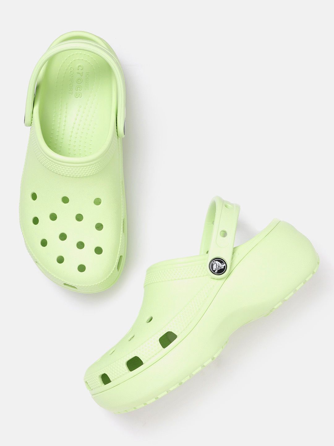 Crocs Women Green Solid Clogs Price in India