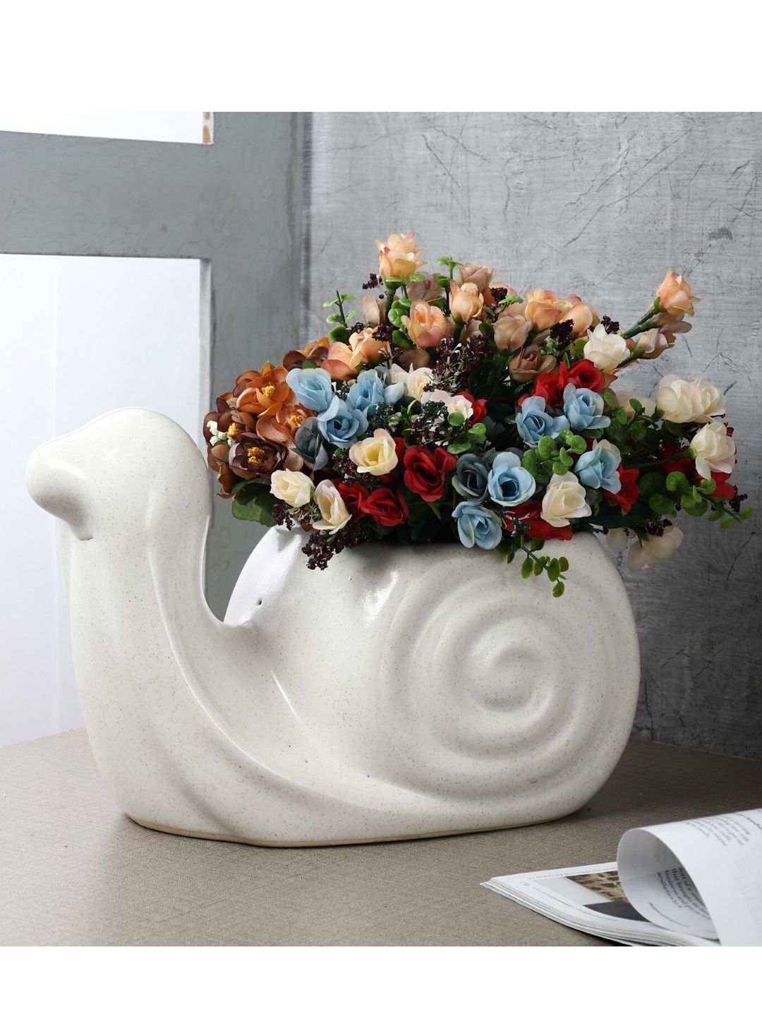 The Decor Mart White Solid Snail Shaped Ceramic Planter Price in India