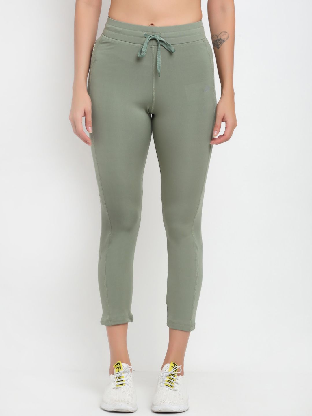 ANTI CULTURE Women Sea Green Solid Dry-Fit Tights Price in India