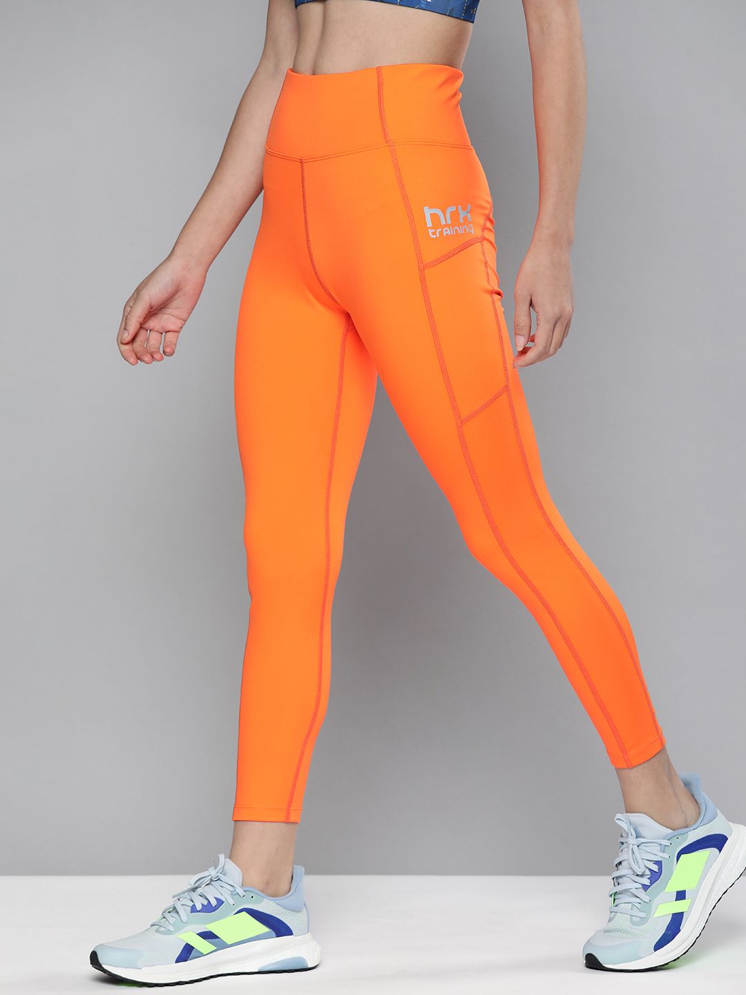HRX By Hrithik Roshan Training Women Neon Orange Rapid-Dry Solid Tights Price in India