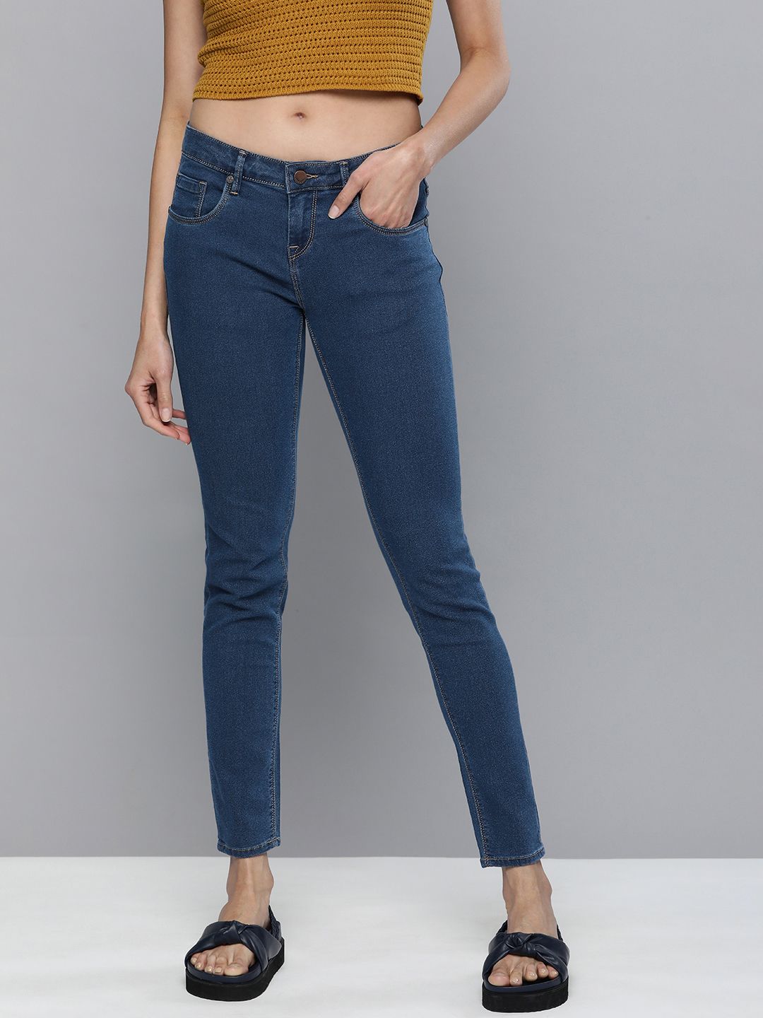 HERE&NOW Women Mid Indigo Blue Slim Fit Mid-Rise Clean Look Stretchable Jeans Price in India