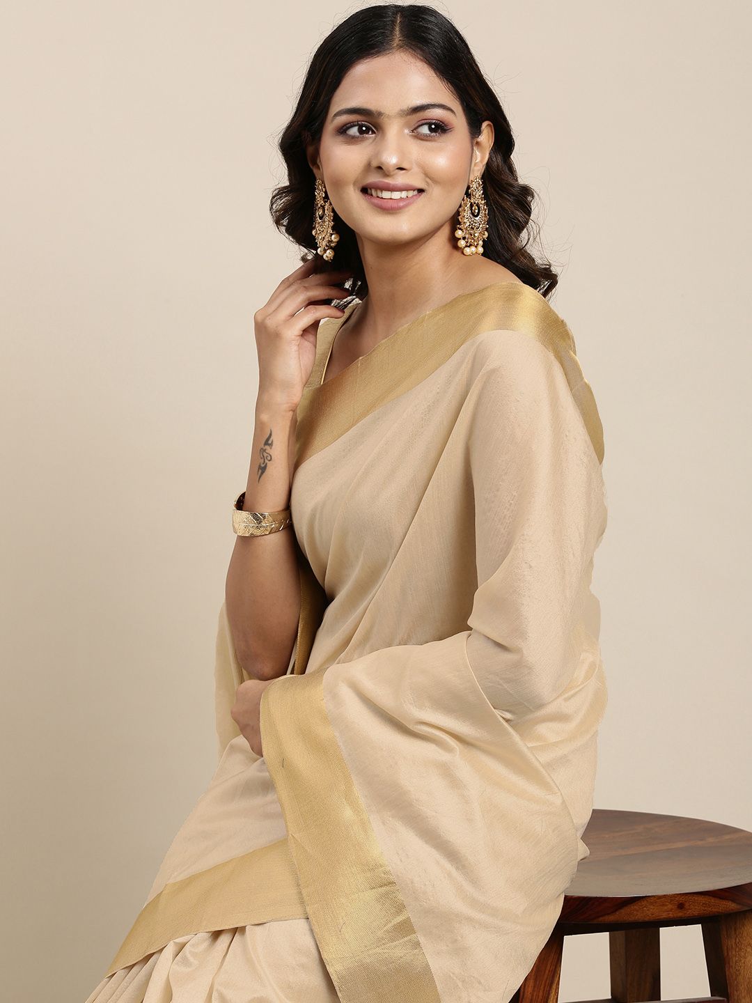 Mitera Women Beige & Golden Pure Georgette Saree Price in India