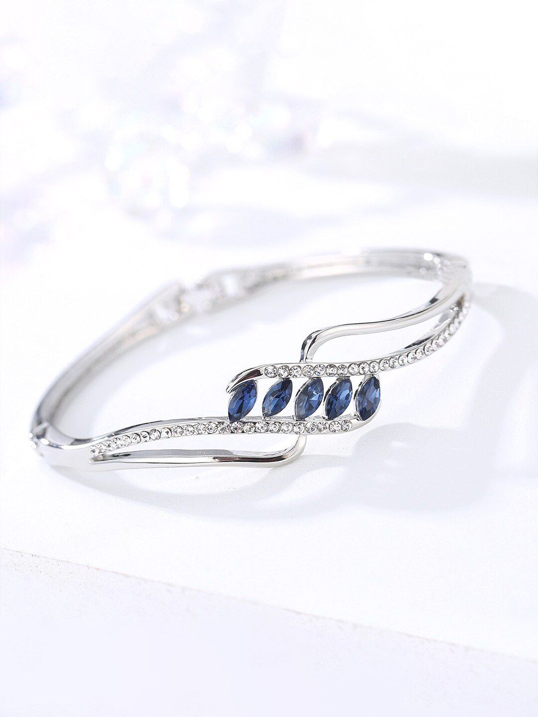 Yellow Chimes Women Silver-Toned & Blue Sparkling Crystal Studded Kada Bracelet Price in India