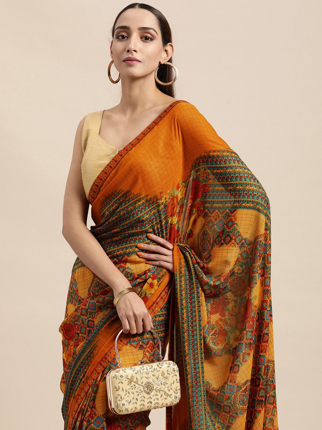 Triveni Orange Pure Georgette Saree