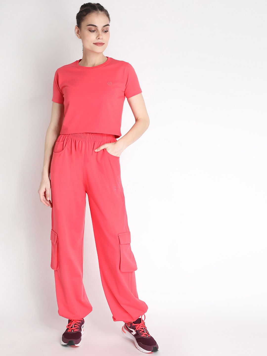 Chkokko Women Peach-Colored Solid Sports Tracksuit Price in India