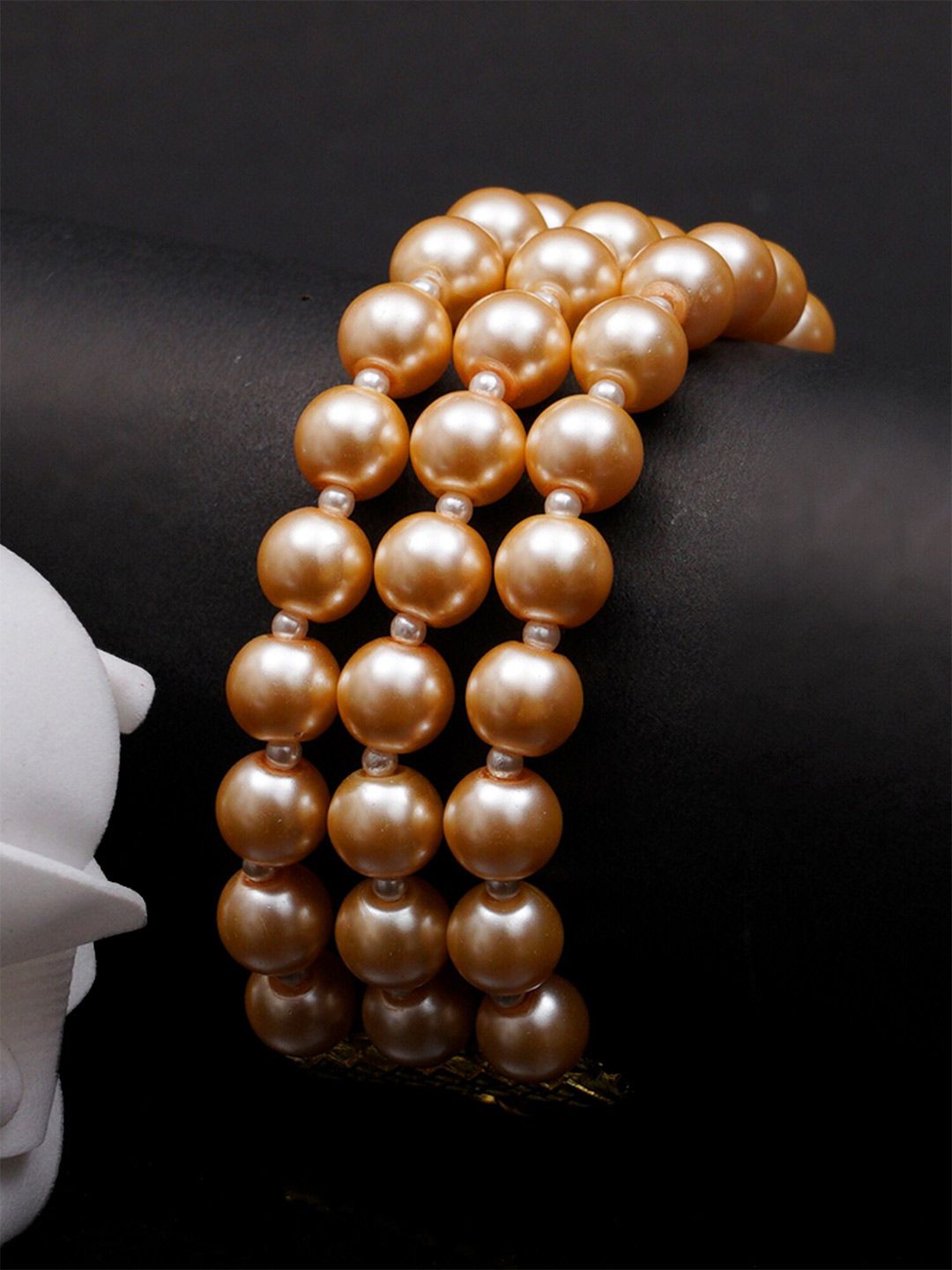 KARATCART Women Gold-Toned & White Gold-Plated Pearl Beaded Kundan Multistrand Bracelet Price in India