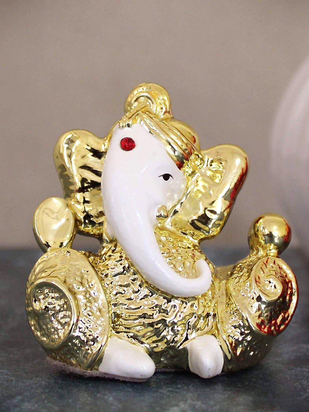 TIED RIBBONS Gold-Toned & White Polyresin Ganesh Idol Statue Showpiece Price in India