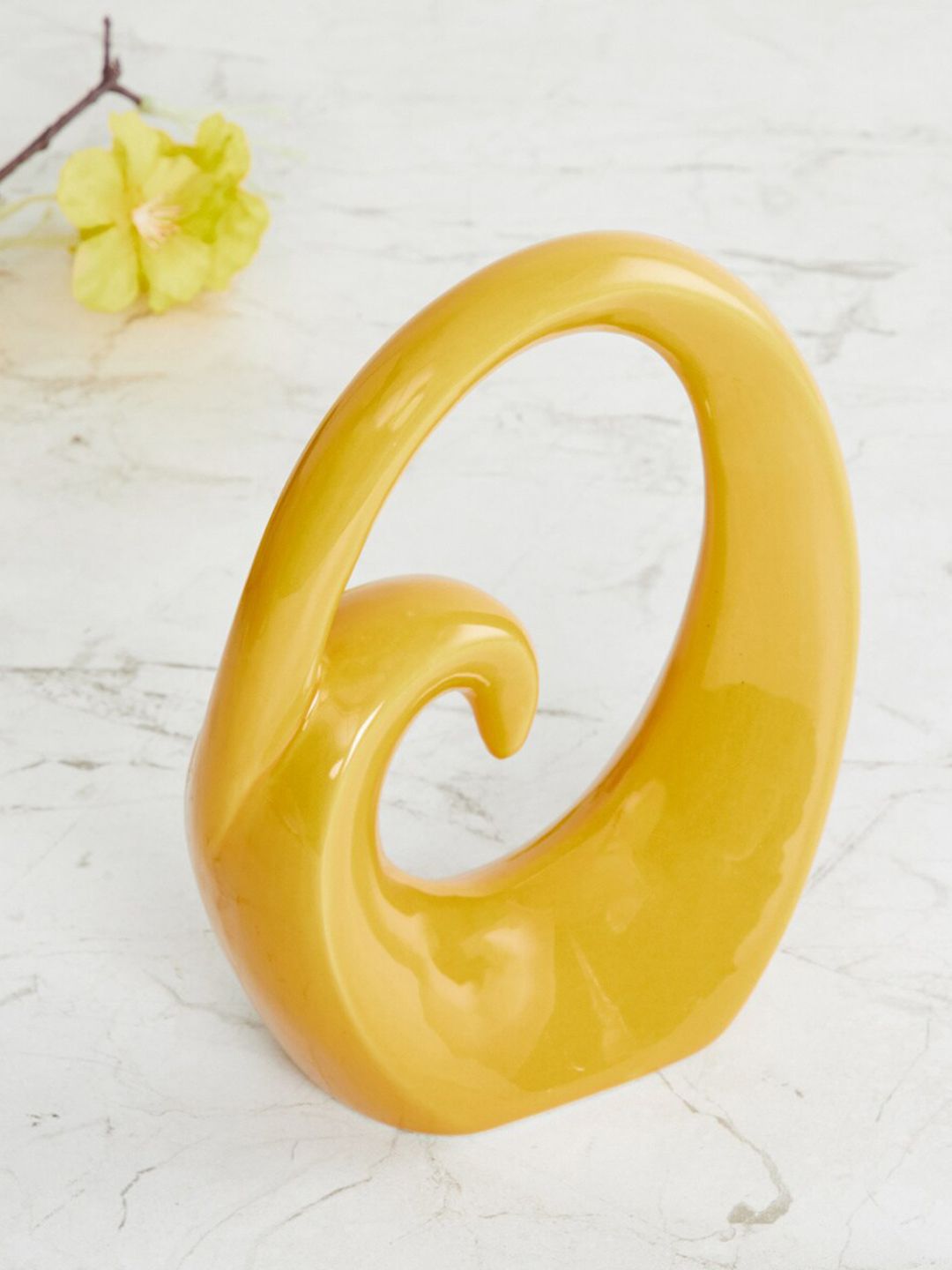 Home Centre Yellow Solid Ceramic Showpiece Price in India