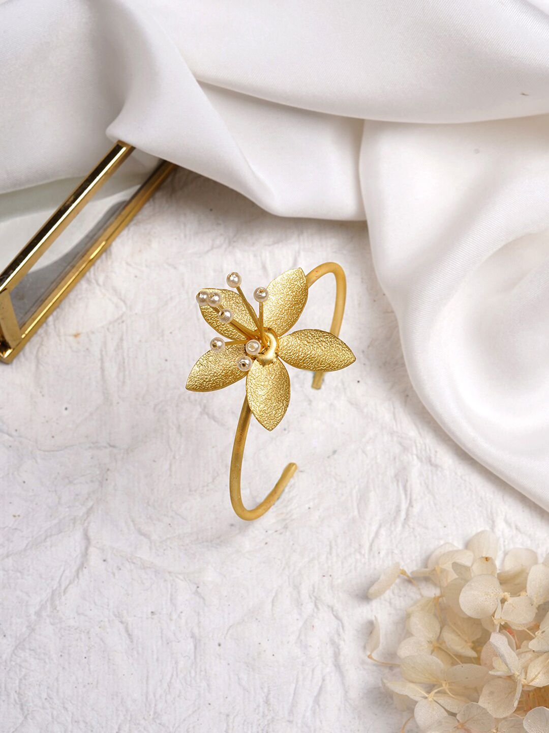 TEEJH Women Gold-Plated & White Teejh Utpala Floral Brass Cuff Bracelet Price in India