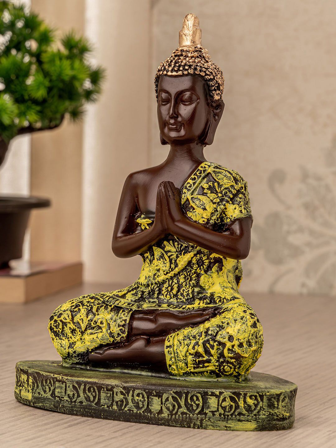 TIED RIBBONS Brown & Yellow Meditating Lord Buddha Showpiece Price in India