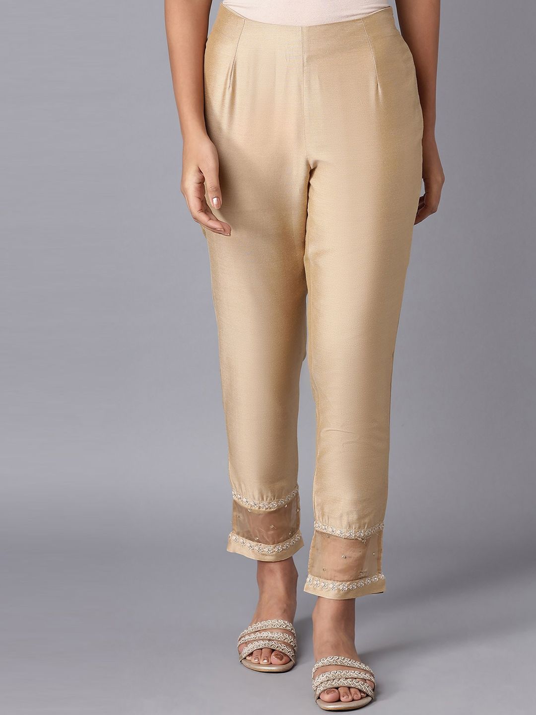 W Women Solid Gold Toned Trousers Price in India
