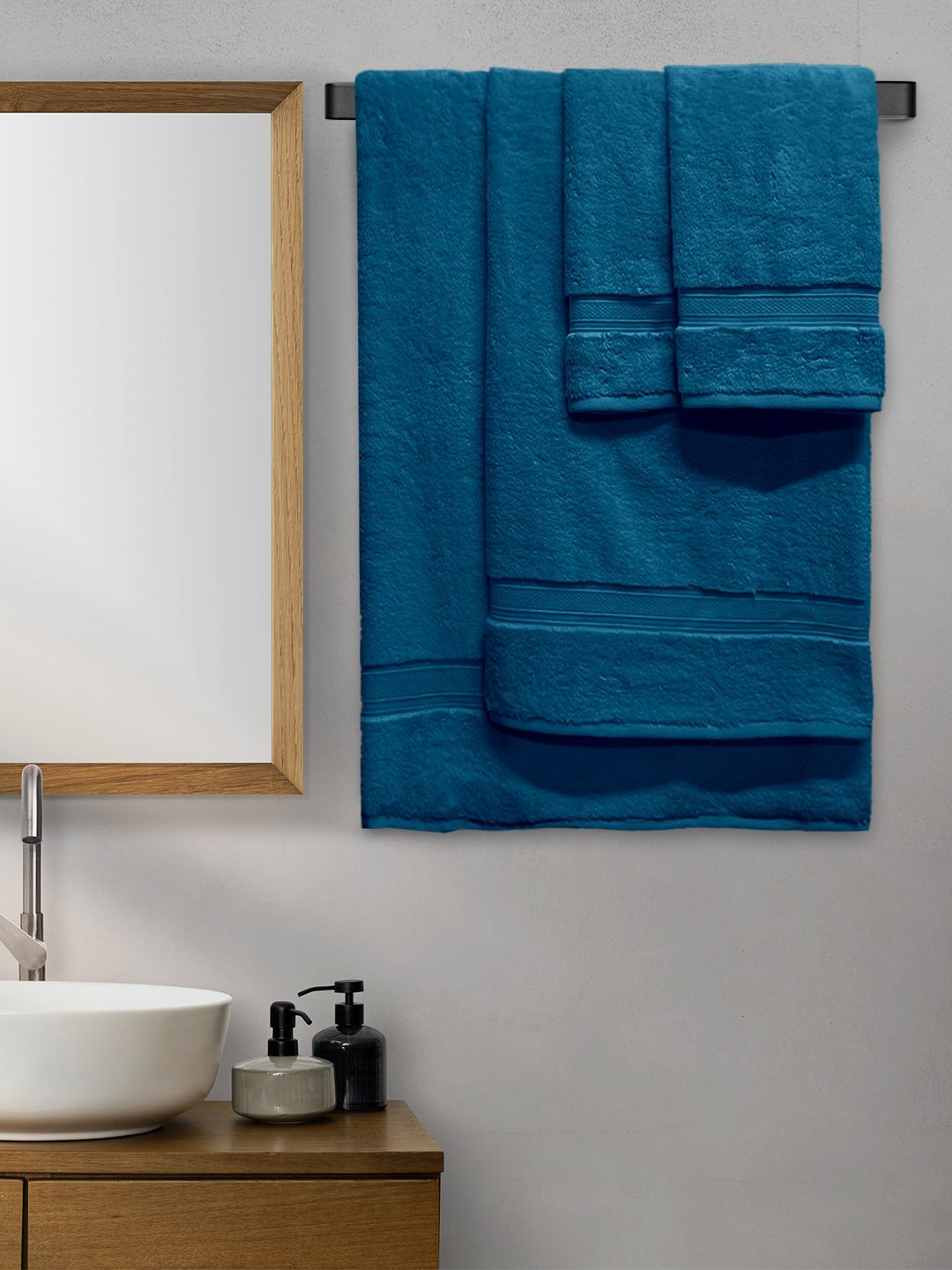 Aura Set Of 4 Teal Blue Solid 600 GSM Cotton Towel Set Price in India
