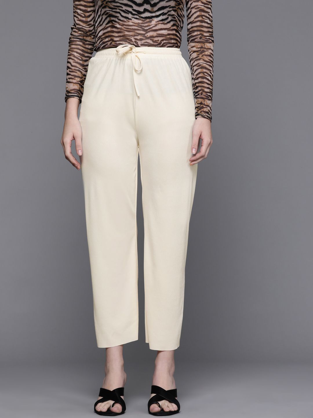 JC Mode Women Beige Solid High-Rise Cropped Trousers Price in India