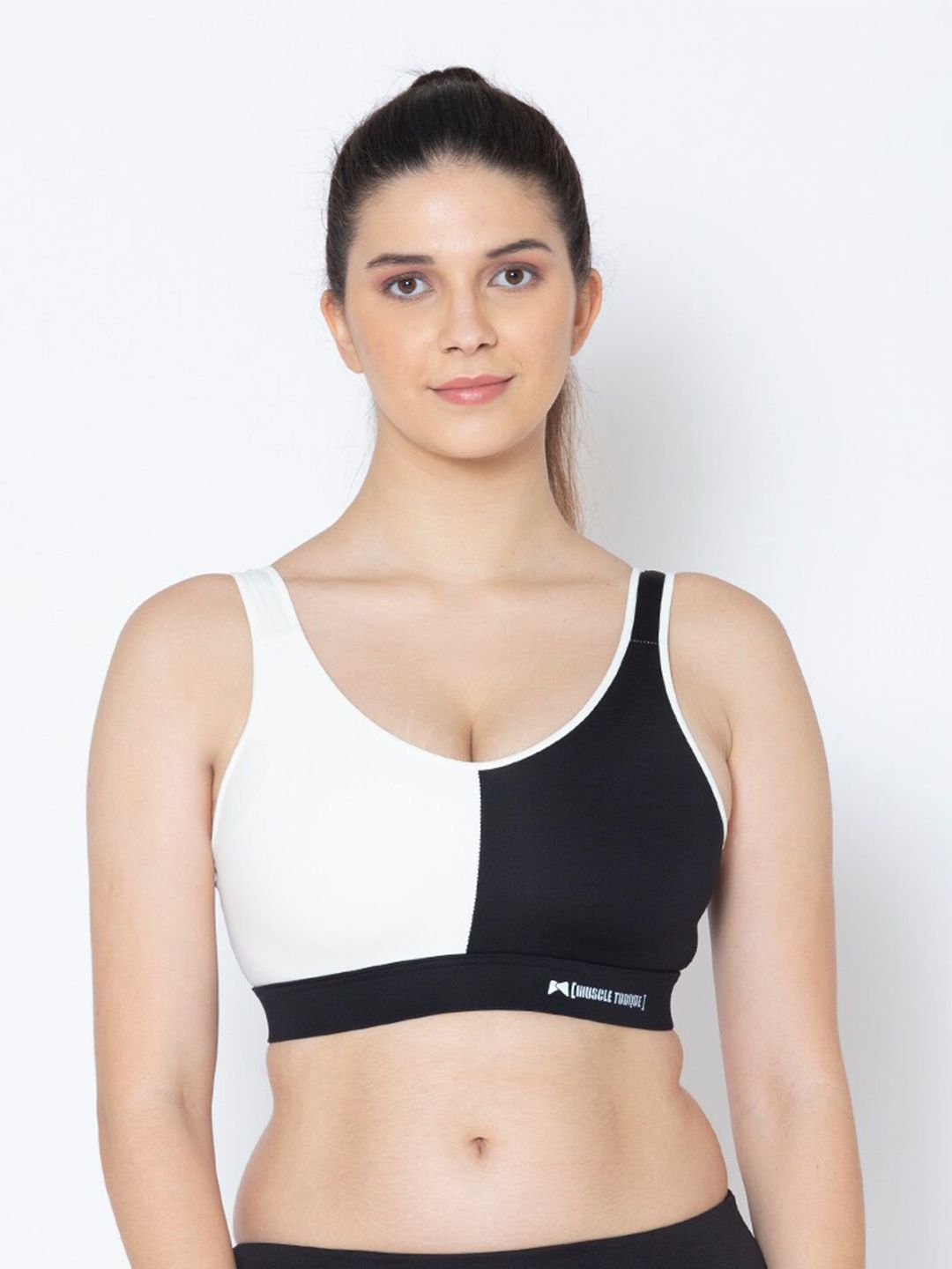 MUSCLE TORQUEBlack & White Colourblocked Removable Padding Sports Bra Price in India