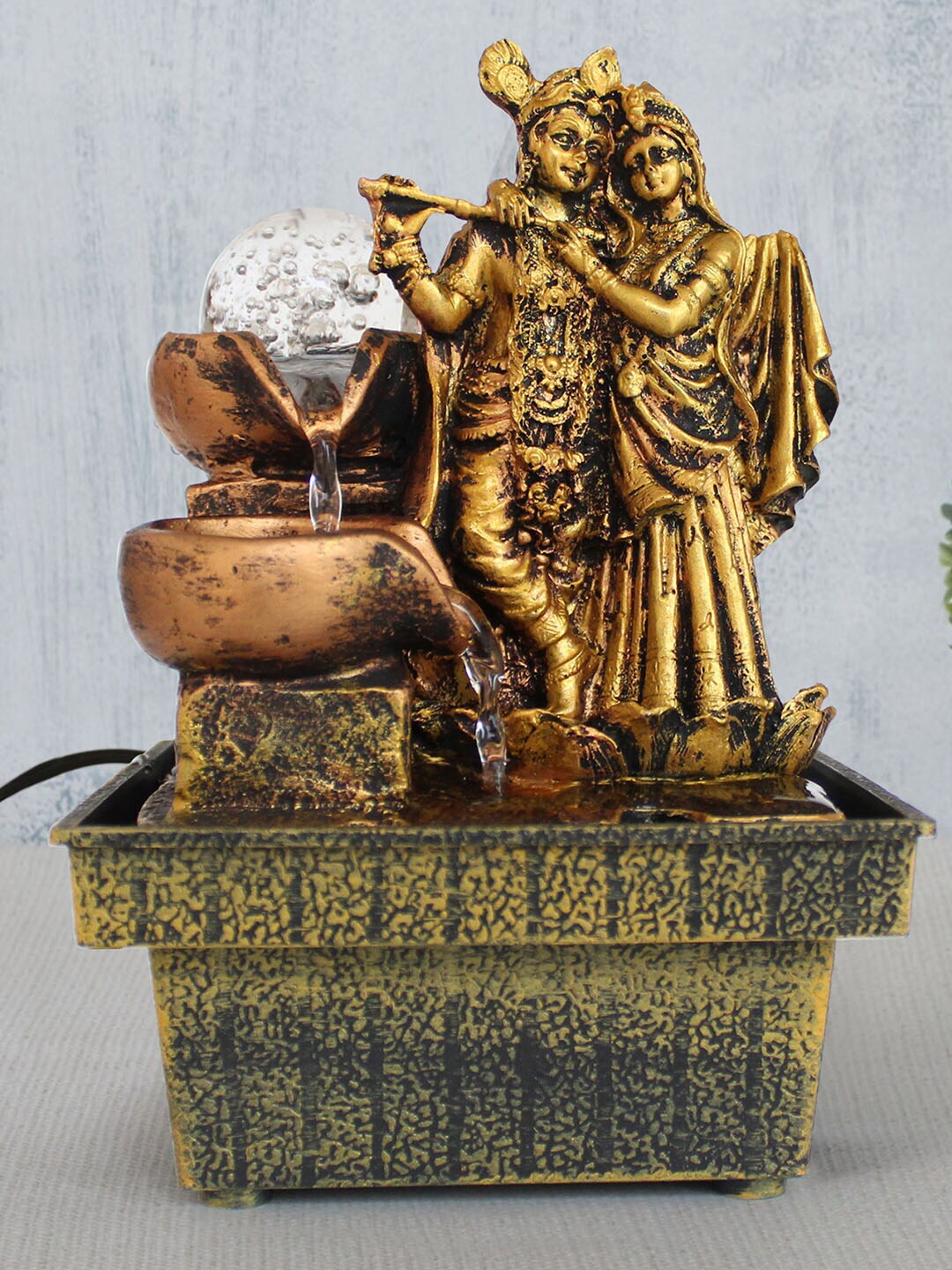 TIED RIBBONS Gold-Toned Decorative Radha Kristna Idol Water Fountain Price in India
