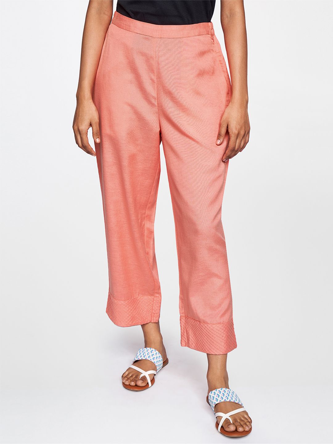 Global Desi Women Coral Orange Tapered Fit Trousers Price in India