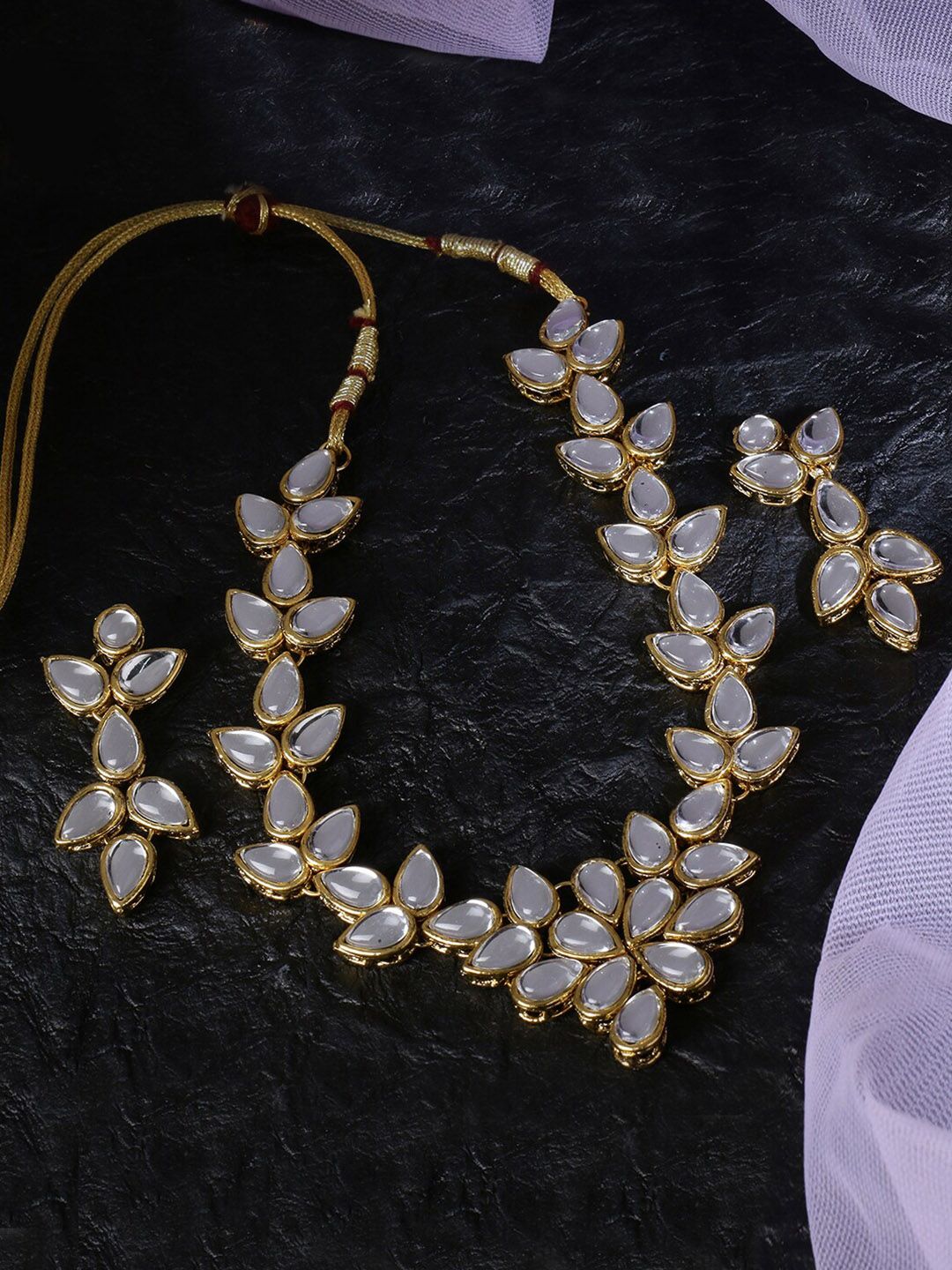 LIVE EVIL Transparent & Gold-Toned Kundan Stone Studded Jewellery Set Price in India