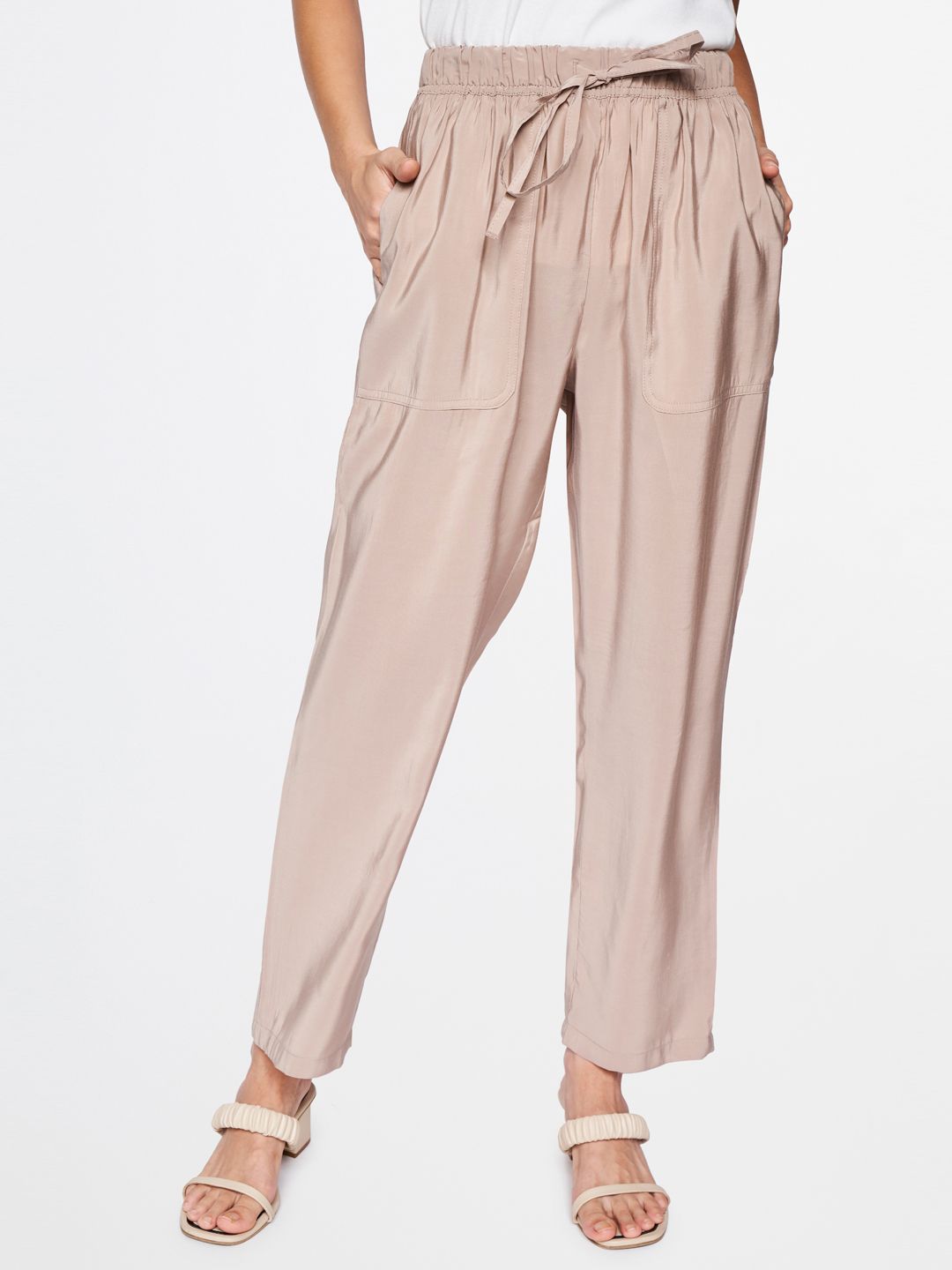 AND Women Beige Straight Fit Easy Wash Pleated Trousers Price in India