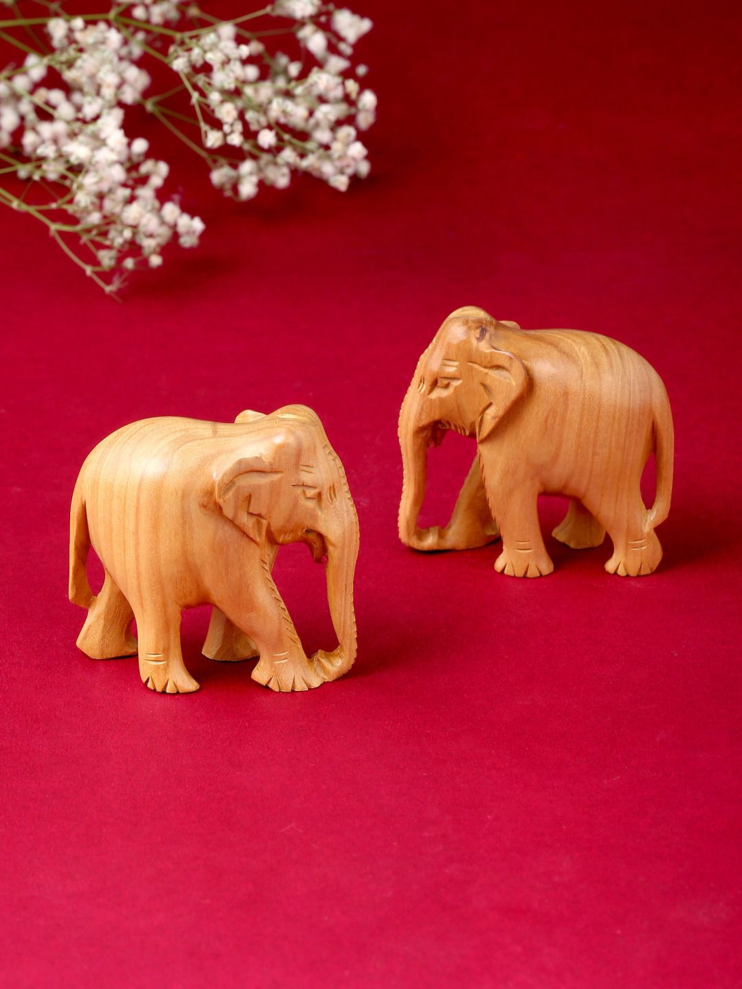 RDK Set Of 2 Beige Natural Sandalwood Elephant Down Trunk Showpiece Price in India