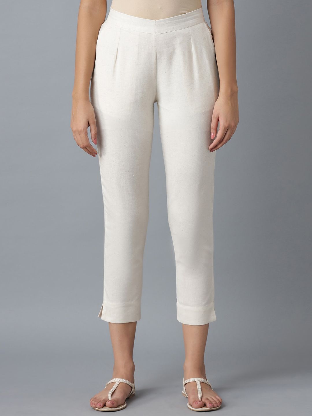 elleven Women White Solid Slim Fit Pleated Trousers Price in India