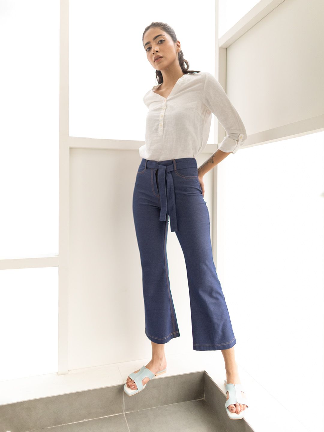 elleven Women Navy Blue Solid Bootcut Trousers Price in India