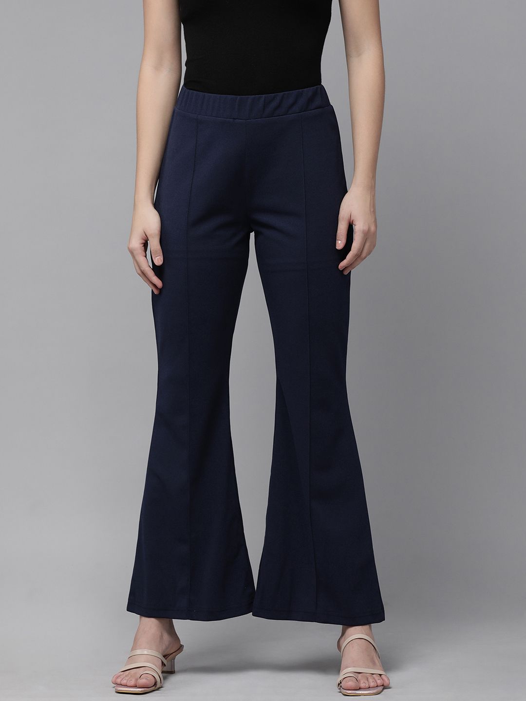 RARE Women Navy Blue Solid Flared Trousers Price in India