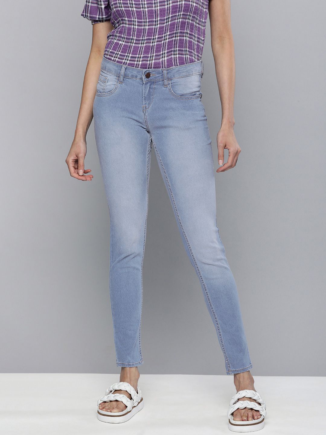 HERE&NOW Women Light Blue Mid-Rise Skinny Fit Heavy Fade Cropped Jeans Price in India