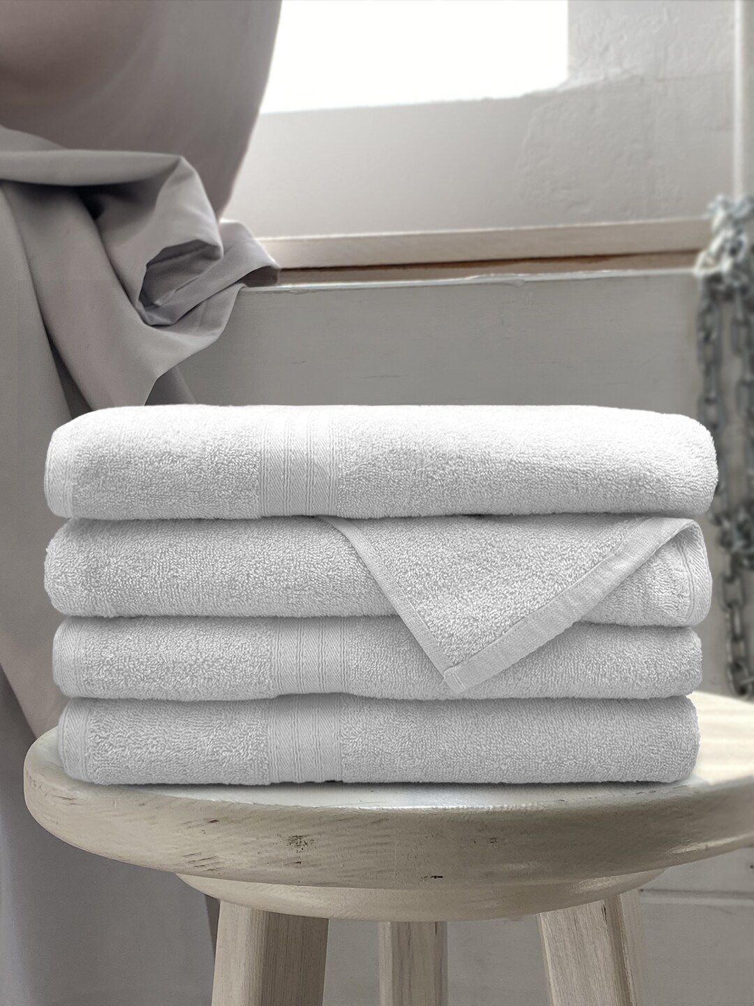 Aura White Set Of 4 Solid Cotton 500 GSM Bath Towels Price in India
