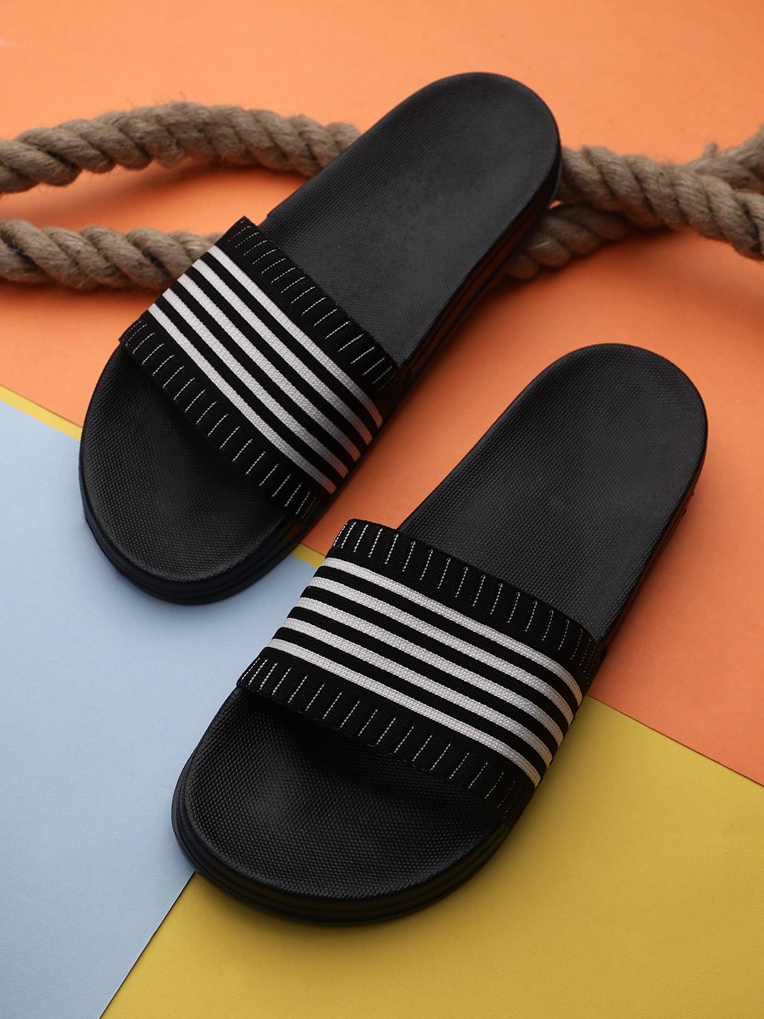 Pampy Angel Women Black & White Striped Rubber Sliders Price in India