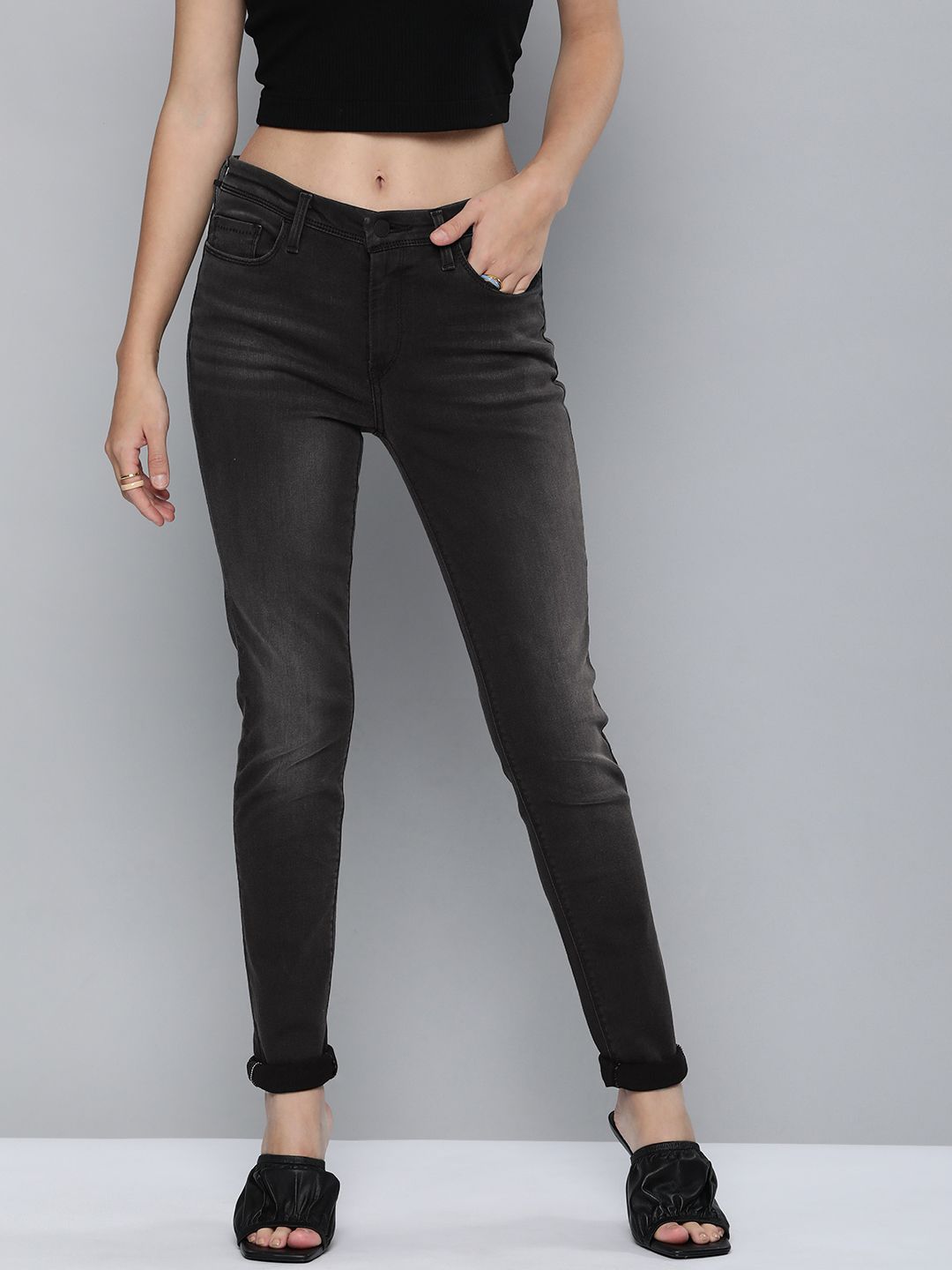 Levis Women Black 711 Skinny Fit Mid Rise Light Fade Stretchable Jeans Price in India