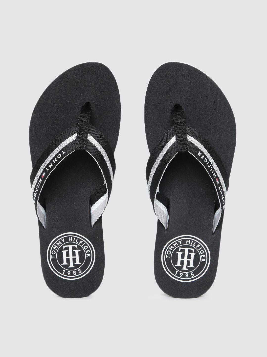 Tommy Hilfiger Women Black & Silver-Toned Striped Essential Mid-Wedge Thong Flip-Flops Price in India
