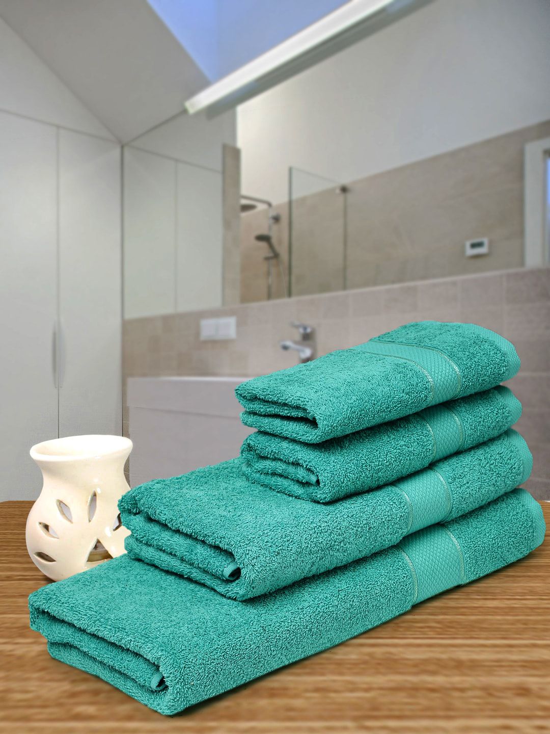 Creeva Set Of 4 Sea Green Solid 525 GSM Cotton Towel Set Price in India