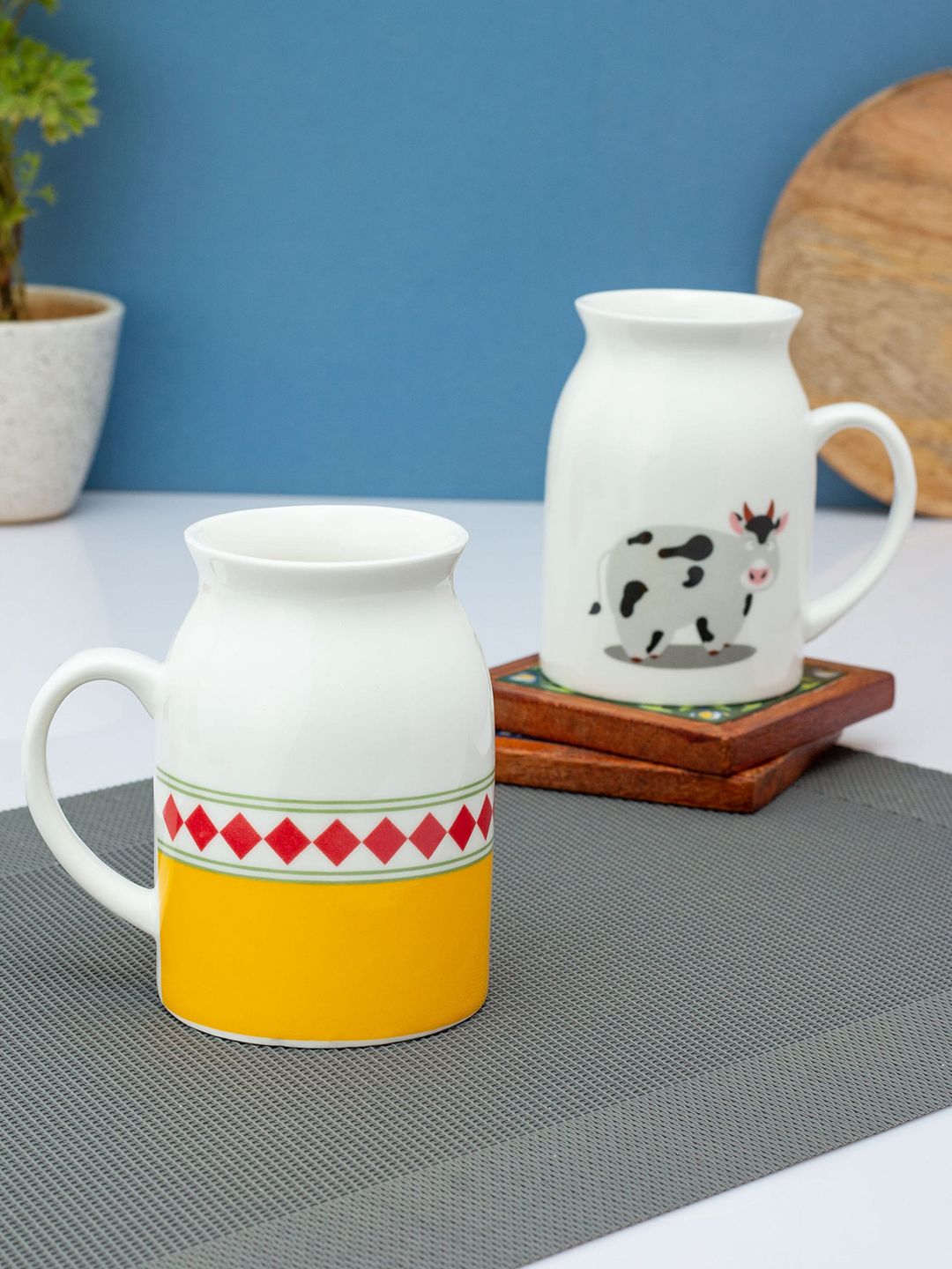 CLAY CRAFT Set If 2 White & Yellow Printed Ceramic Glossy Mugs Price in India