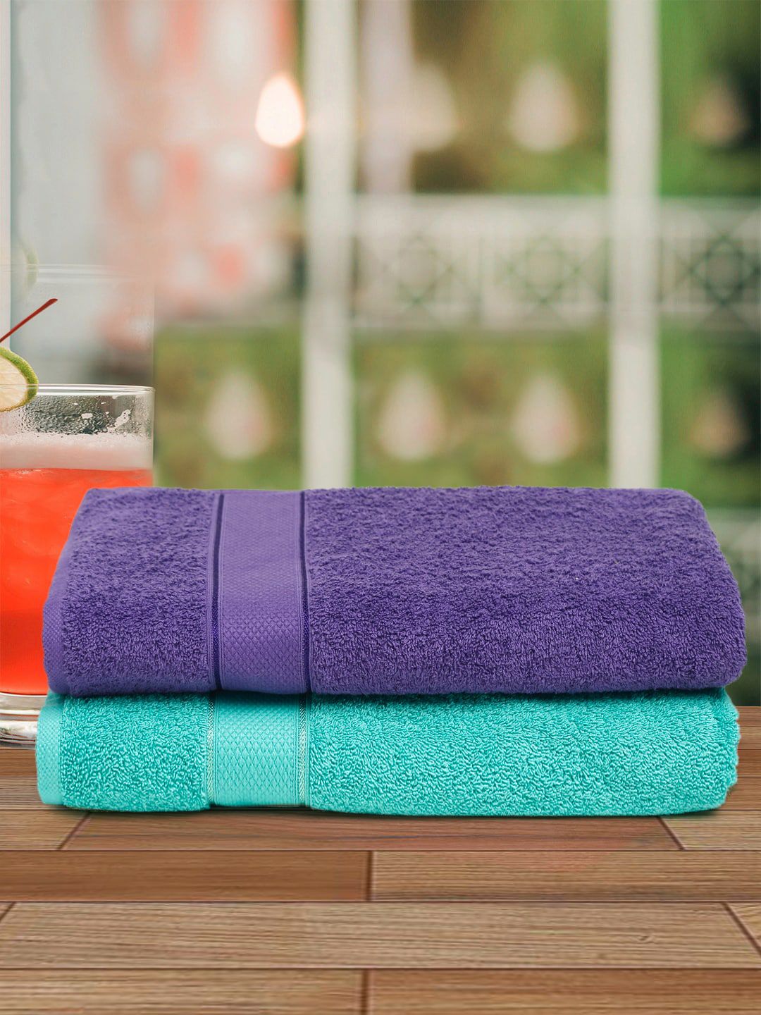 Creeva Pack of 2 Violet & Green Solid 525 GSM Cotton Bath Towels Price in India