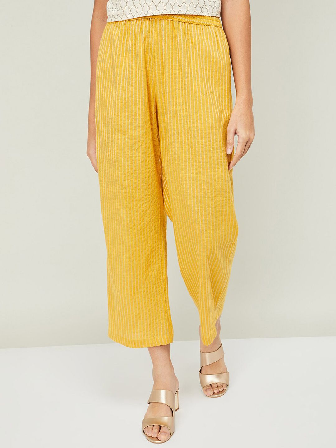 Melange by Lifestyle Women Mustard Yellow Striped Cotton Parallel Trousers Price in India