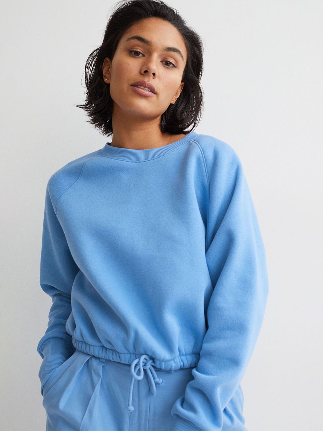H&M Women Blue Solid Drawstring Sweatshirt Price in India