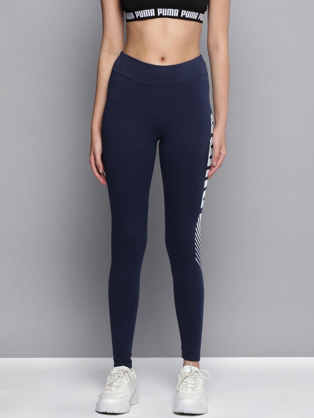 Puma Women Navy Blue & White Brand Logo Printed Essentials Graphic Tight Fit Tights Price in India