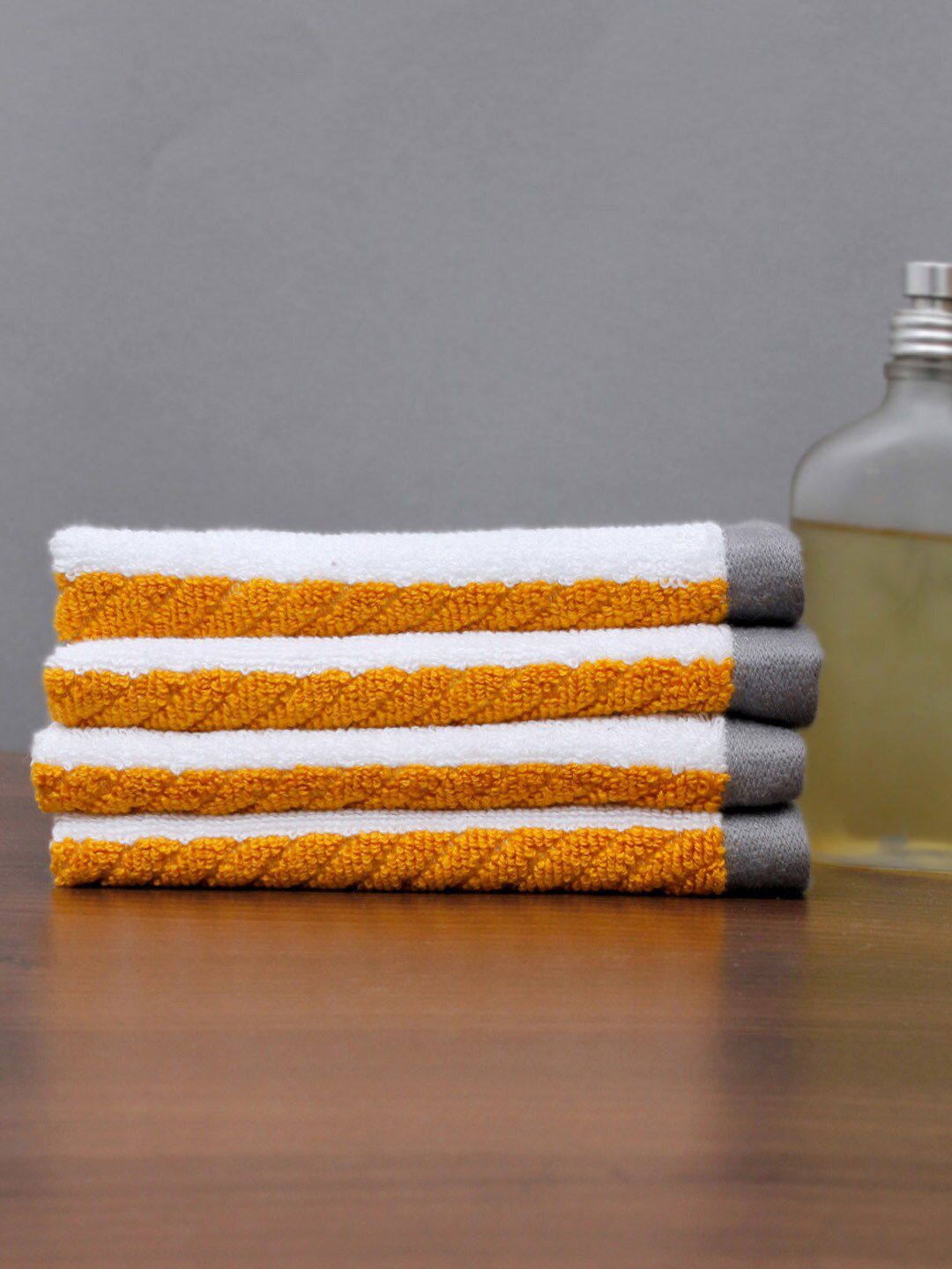 AVI Living Pack Of 4 White & Yellow Face Towels Price in India