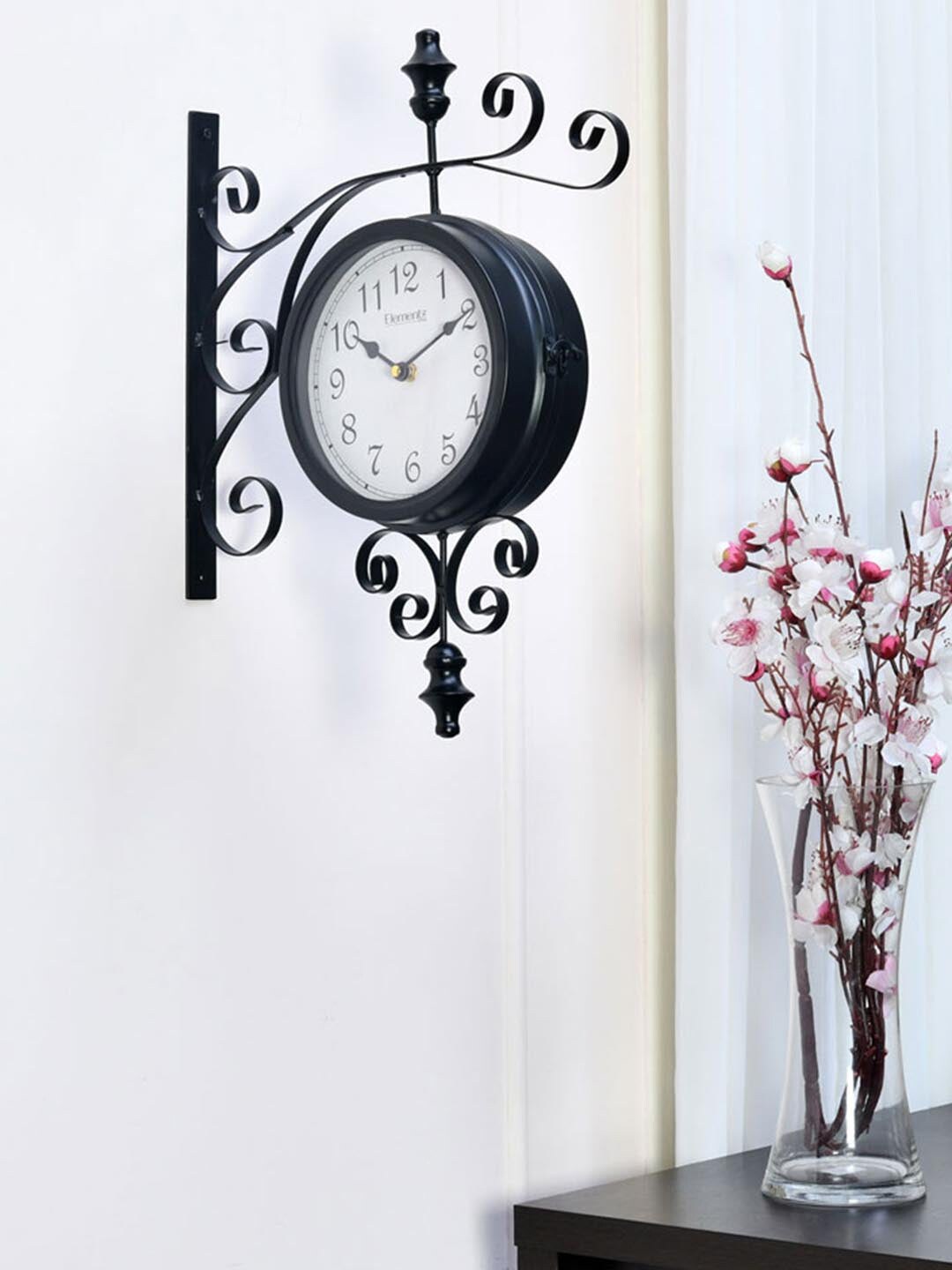 Athome by Nilkamal Black Textured Traditional Analogue Wall Clock Price in India