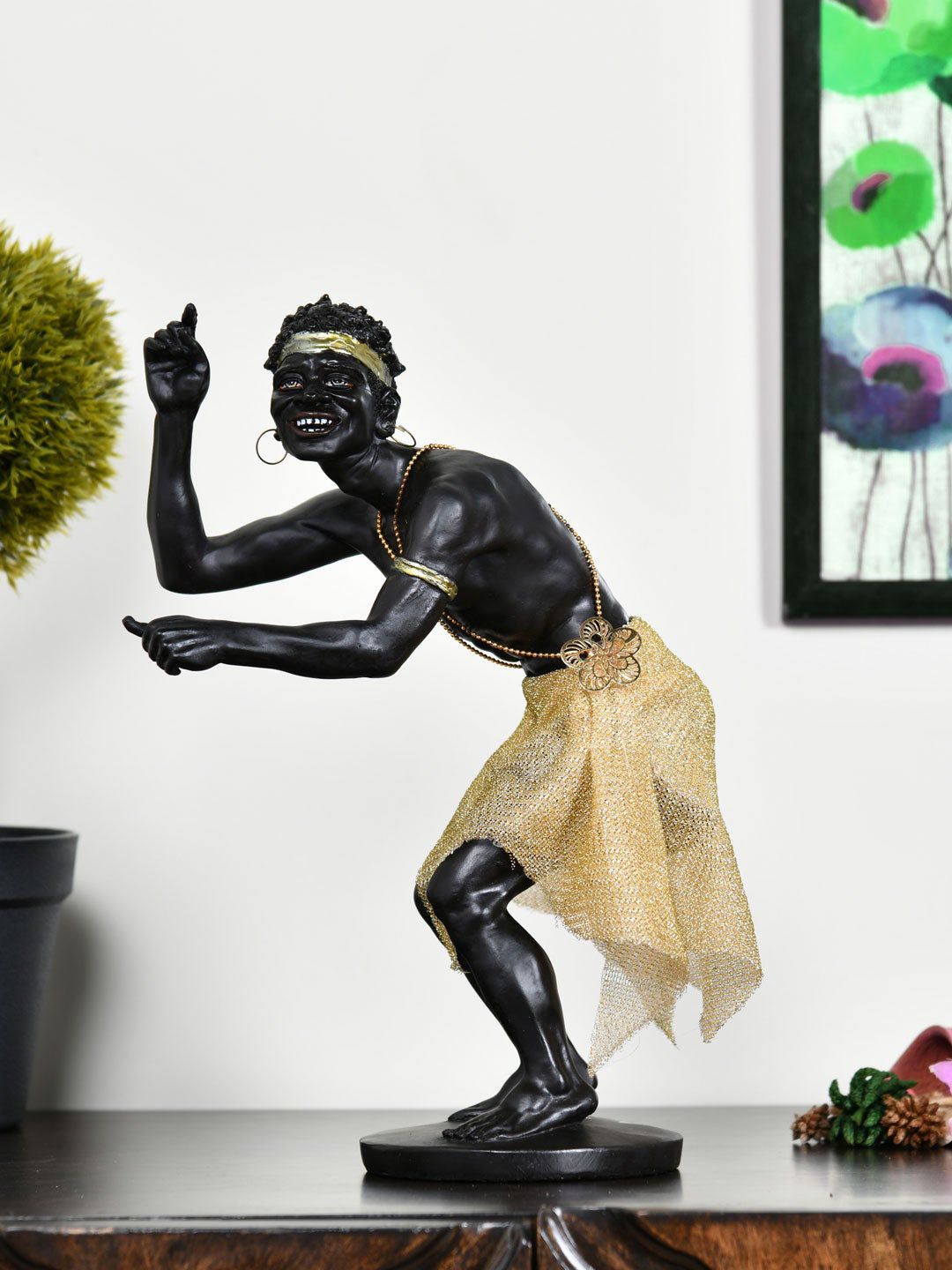 Athome by Nilkamal Black & Gold Colored Tribal Man Dancing Showpiece Price in India