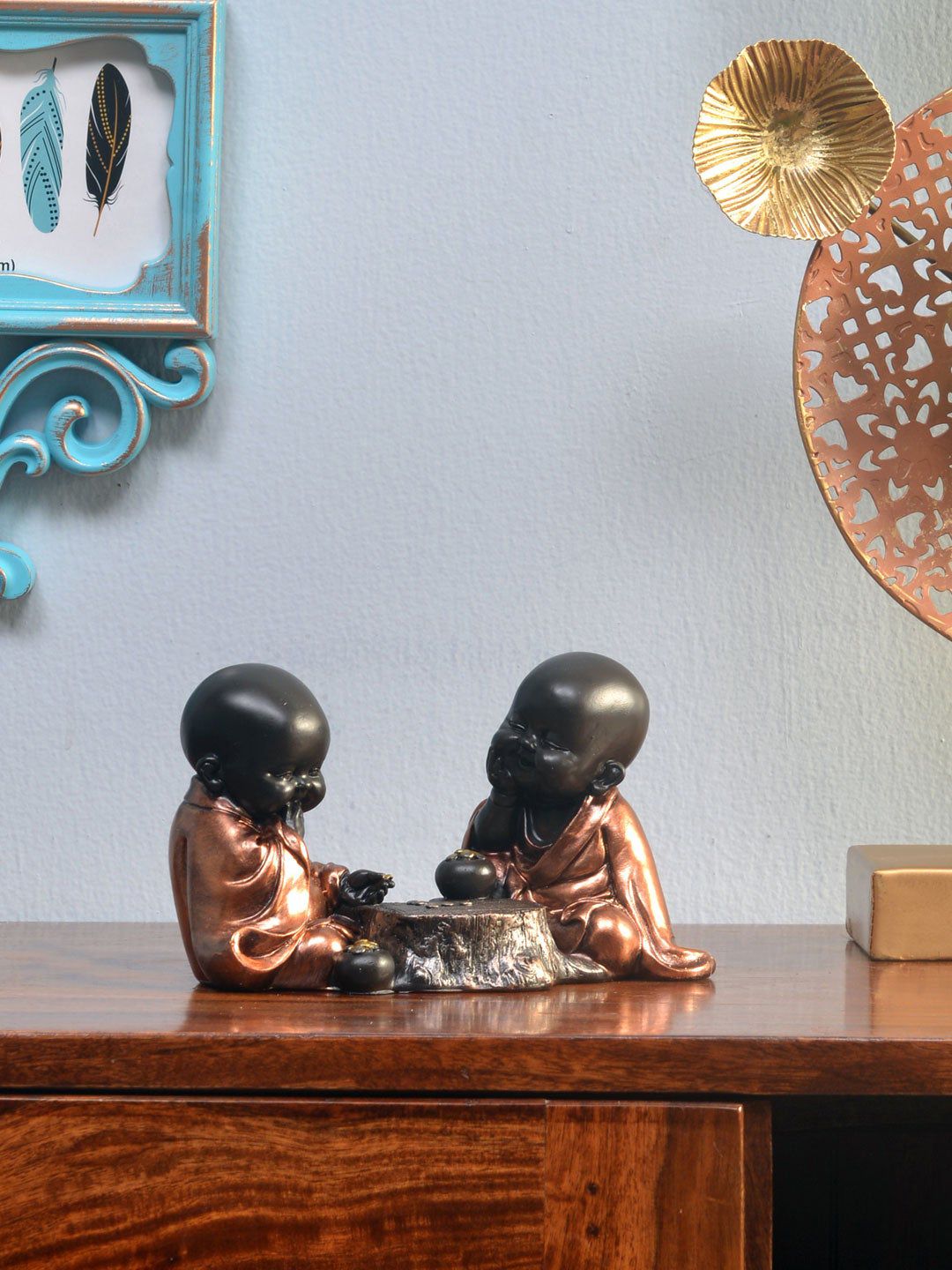Athome by Nilkamal Brown Baby Monks Playing Showpiece Price in India