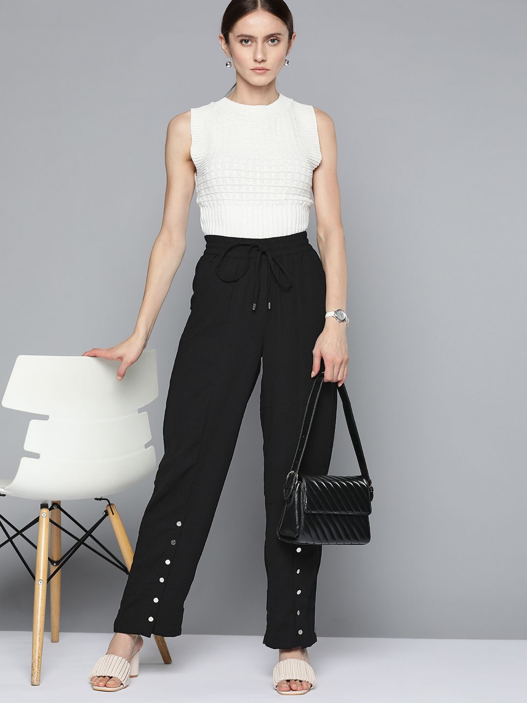 Chemistry Women Black Solid Button Detail Trousers Price in India